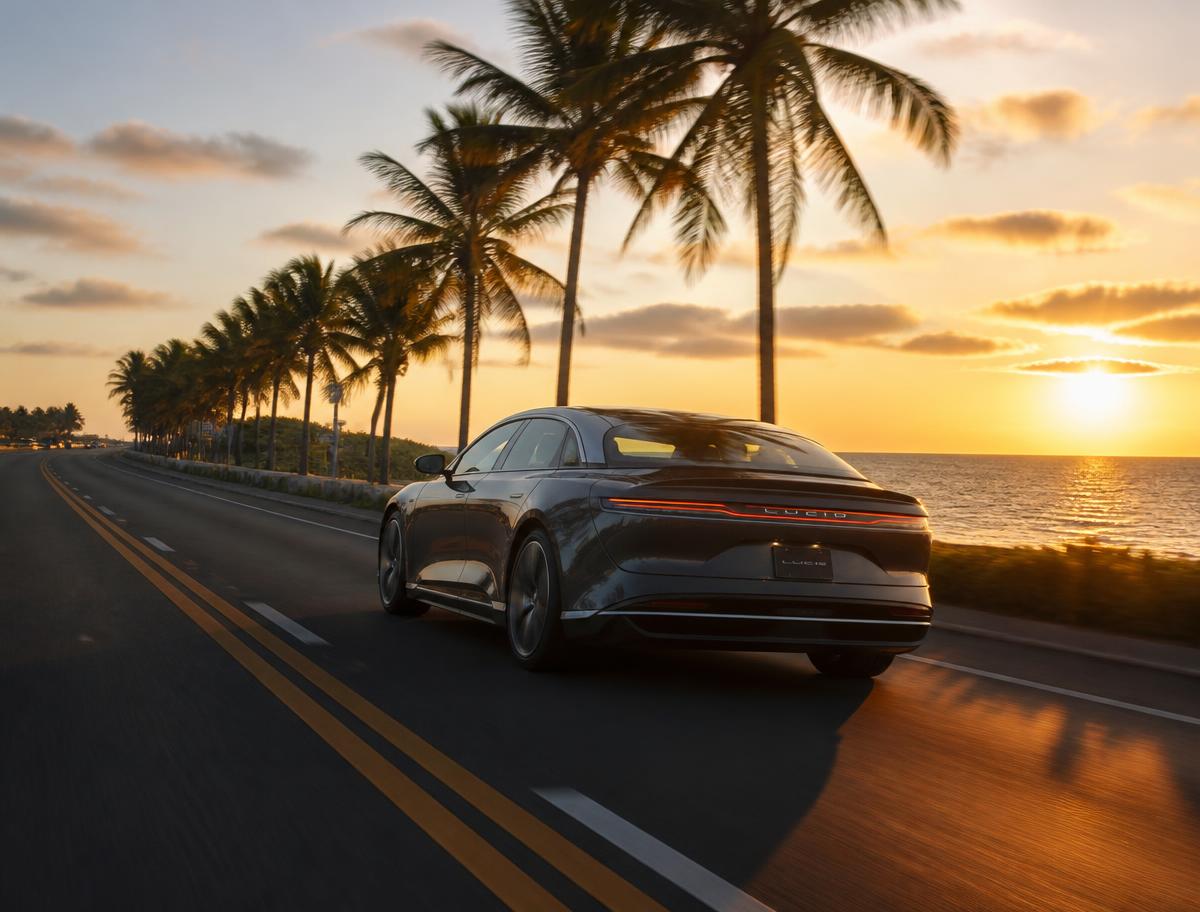 Car driving along a Florida coastal highway at golden hour